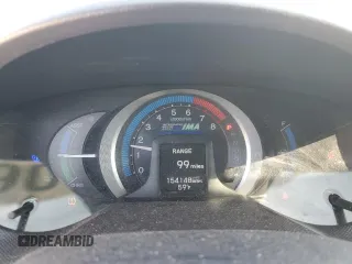 2010 Honda Insight EX z VIN JHMZE2H74AS034758, wystawiony jako Copart lot #52905445 z przebiegiem 154 148 mil mil oraz Szkoda całkowita • Salvage title. Historia ofert i sprzedaży dostępna na DreamBid. Obrazek 9.