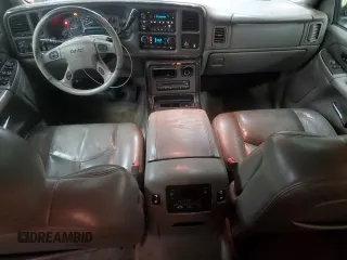 2005 GMC Yukon Denali z VIN 1GKEK63U45J222600, wystawiony jako Copart lot #51329775 z przebiegiem 287 293 mil mil oraz Czysty tytuł • Clean title. Historia ofert i sprzedaży dostępna na DreamBid. Obrazek 8.