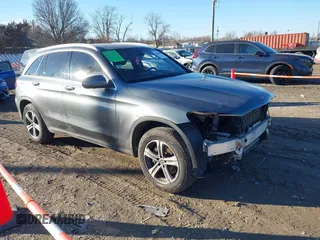 2019 Mercedes-Benz GLC with VIN WDC0G4KB6KV195734, listed as a IAAI auction lot 41666697 with 52,560 mi miles. Bid and sale history available at carsss.com. Image 1.