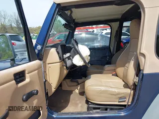 2000 Jeep Wrangler Sport with VIN 1J4FA49S5YP750123, listed as a IAAI auction lot 42060009 with Not Provided miles. Bid and sale history available at carsss.com. Image 5.