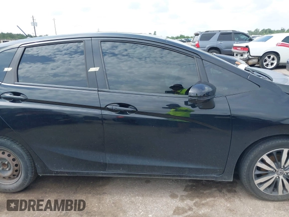 2015 Honda Fit EX-L z VIN 3HGGK5H81FM723962, wystawiony jako IAAI lot #42455367 z przebiegiem 104 859 mil mil oraz . Historia ofert i sprzedaży dostępna na DreamBid. Obrazek 13.