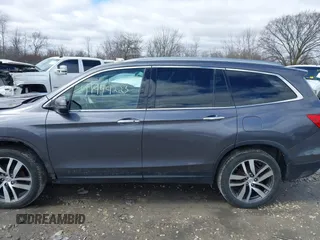 2017 Honda Pilot Touring with VIN 5FNYF6H92HB036406, listed as a IAAI auction lot 41949223 with 147,462 mi miles. Bid and sale history available at carsss.com. Image 14.
