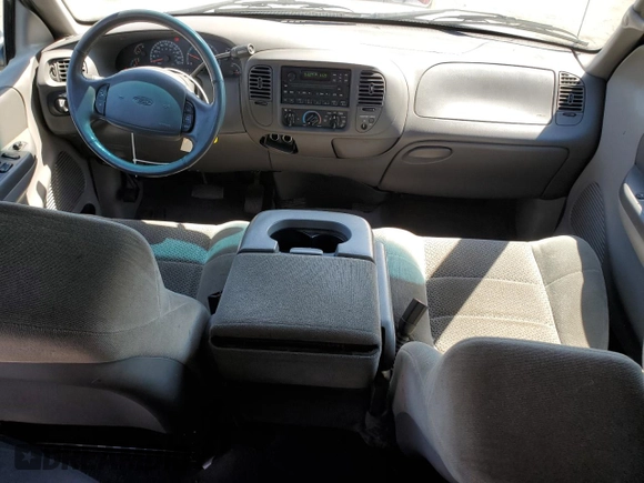 2002 Ford F-150 XL with VIN 1FTRX17212NA28461, listed as a Copart auction lot 63710665 with 185,460 mi miles and Salvage title. Bid and sale history available at DreamBid. Image 8.