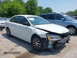2014 Volkswagen Jetta S z VIN 3VW2K7AJ7EM289320, wystawiony jako IAAI lot #42477632 z przebiegiem 154 838 mil mil oraz . Historia ofert i sprzedaży dostępna na DreamBid. Obrazek 1.