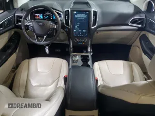 2021 Ford Edge Titanium with VIN 2FMPK4K96MBA38750, listed as a Copart auction lot 61401615 with 34,778 mi miles and Salvage title. Bid and sale history available at DreamBid. Image 8.