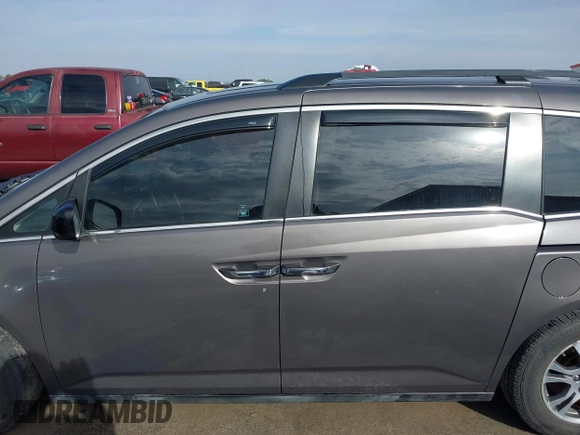 2012 Honda Odyssey EX-L with VIN 5FNRL5H60CB094682, listed as a IAAI auction lot 41570797 with 127,890 mi miles and . Bid and sale history available at carsss.com. Image 14.