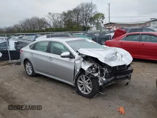 2014 Toyota Avalon Limited with VIN 4T1BK1EB8EU133085, listed as a IAAI auction lot 40949898 with 126,697 mi miles. Bid and sale history available at carsss.com. Image 1.
