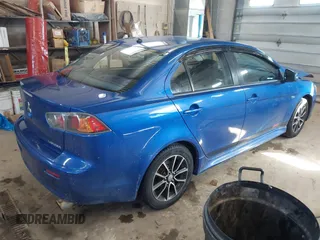 2017 Mitsubishi Lancer ES with VIN JA32V2FW4HU006890, listed as a IAAI auction lot 41636035 with 165,077 mi miles. Bid and sale history available at carsss.com. Image 4.