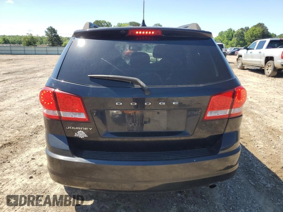 2013 Dodge Journey SE with VIN 3C4PDCAB5DT729415, listed as a Copart auction lot 55851915 with 128,782 mi miles and Salvage title. Bid and sale history available at DreamBid. Image 6.