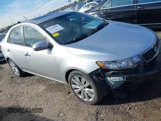 2012 Kia Forte SX with VIN KNAFW4A37C5621409, listed as a IAAI auction lot 41608698 with 202,731 mi miles. Bid and sale history available at carsss.com. Image 1.