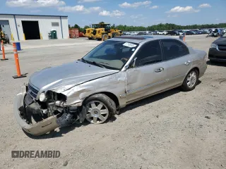 2006 Kia Optima LX z VIN KNAGD126865465791, wystawiony jako Copart lot #57760505 z przebiegiem 134 080 mil mil oraz Szkoda całkowita • Salvage title. Historia ofert i sprzedaży dostępna na DreamBid. Obrazek 1.
