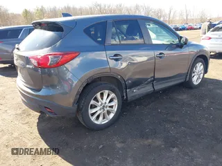 2013 Mazda CX-5 Grand Touring with VIN JM3KE4DE1D0164488, listed as a IAAI auction lot 41683326 with 129,989 mi miles. Bid and sale history available at carsss.com. Image 4.
