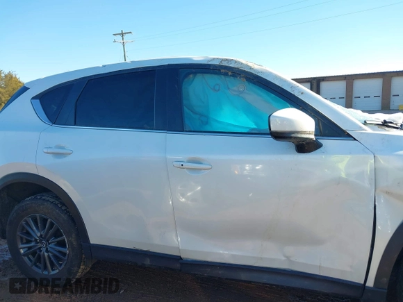 2020 Mazda CX-5 Touring with VIN JM3KFBCM0L0828207, listed as a IAAI auction lot 41305801 with 56,500 mi miles and . Bid and sale history available at DreamBid. Image 13.