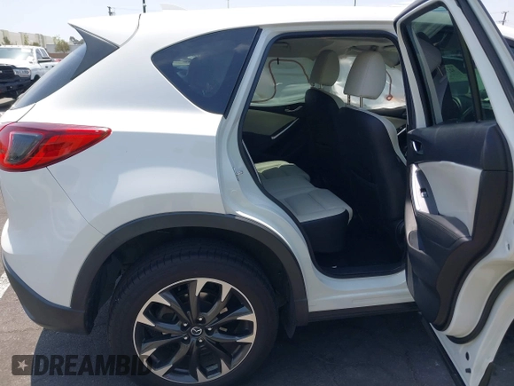 2016 Mazda CX-5 Grand Touring z VIN JM3KE2DY2G0824802, wystawiony jako IAAI lot #42170591 z przebiegiem 53 173 mil mil oraz . Historia ofert i sprzedaży dostępna na DreamBid. Obrazek 8.