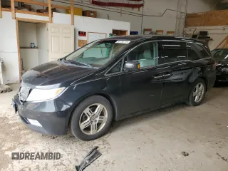 2012 Honda Odyssey Touring with VIN 5FNRL5H96CB035954, listed as a Copart auction lot 58755715 with 256,538 mi miles and Salvage title. Bid and sale history available at DreamBid. Image 1.