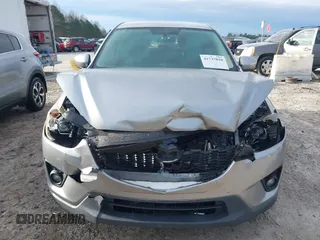 2015 Mazda CX-5 Touring with VIN JM3KE2CYXF0435583, listed as a IAAI auction lot 41737810 with 107,270 mi miles and . Bid and sale history available at DreamBid. Image 12.