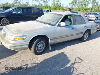 1997 Mercury Grand Marquis GS z VIN 2MELM74W6VX625065, wystawiony jako IAAI lot #42055672 z przebiegiem 125 494 mil mil oraz . Historia ofert i sprzedaży dostępna na DreamBid. Obrazek 2.