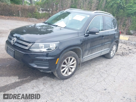 2017 Volkswagen Tiguan Wolfsburg Edition with VIN WVGSV7AX3HK037795, listed as a IAAI auction lot 42497812 with 86,211 mi miles and . Bid and sale history available at DreamBid. Image 2.