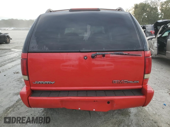 1996 GMC Jimmy SL z VIN 1GKDT13WXT2502347, wystawiony jako Copart lot #74502444 z przebiegiem 253 735 mil mil oraz Szkoda całkowita • Salvage title. Historia ofert i sprzedaży dostępna na DreamBid. Obrazek 6.