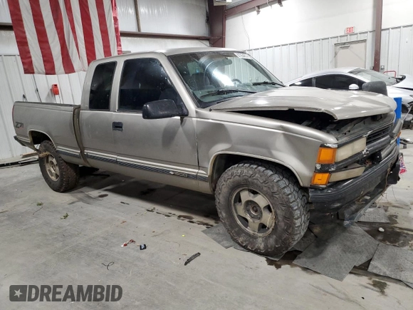 1998 Chevrolet Silverado 1500 with VIN 2GCEK19R9W1105382, listed as a Copart auction lot 87264814 with 290,006 mi miles and Salvage Title. Bid and sale history available at DreamBid. Image 4.
