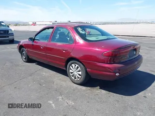 1999 Ford Contour z VIN 1FAFP6538XK117065, wystawiony jako IAAI lot #42088857 z przebiegiem 138 489 mil mil oraz . Historia ofert i sprzedaży dostępna na DreamBid. Obrazek 3.