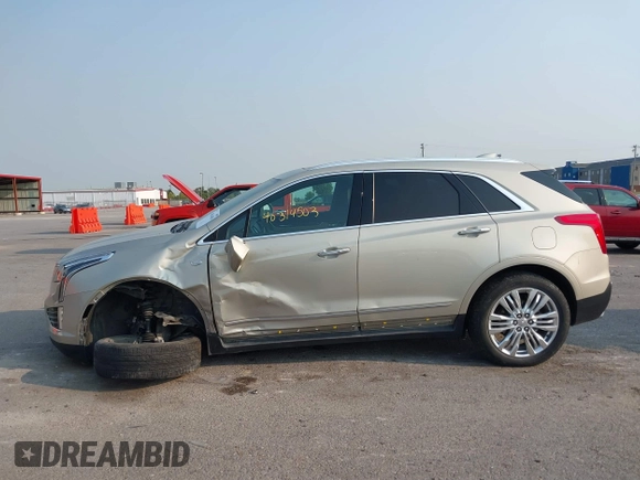 2017 Cadillac XT5 Premium Luxury FWD z VIN 1GYKNCRSXHZ164468, wystawiony jako IAAI lot #40314503 z przebiegiem 94 008 mil mil oraz . Historia ofert i sprzedaży dostępna na DreamBid. Obrazek 14.