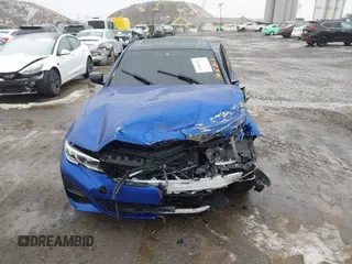 2022 BMW 3 Series 330i z VIN 3MW5R1J06N8C49056, wystawiony jako IAAI lot #41496252 z przebiegiem Nie podano mil oraz . Historia ofert i sprzedaży dostępna na DreamBid. Obrazek 11.