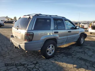 1999 Jeep Grand Cherokee Laredo with VIN 1J4GW58NXXC747537, listed as a Copart auction lot 87310234 with Not provided miles and Salvage title. Bid and sale history available at DreamBid. Image 3.