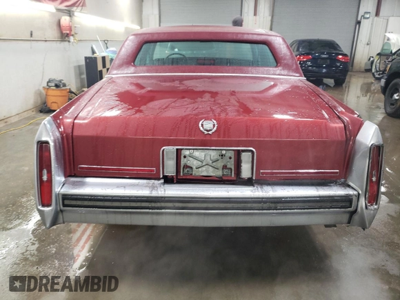 1988 Cadillac Brougham z VIN 1G6DW51Y2JR766782, wystawiony jako Copart lot #83797924 z przebiegiem 63 601 mil mil oraz Szkody całkowita. Historia ofert i sprzedaży dostępna na DreamBid. Obrazek 6.