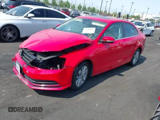 2015 Volkswagen Jetta SE with VIN 3VWD17AJ7FM303892, listed as a IAAI auction lot 42386050 with 50,998 mi miles and . Bid and sale history available at DreamBid. Image 2.