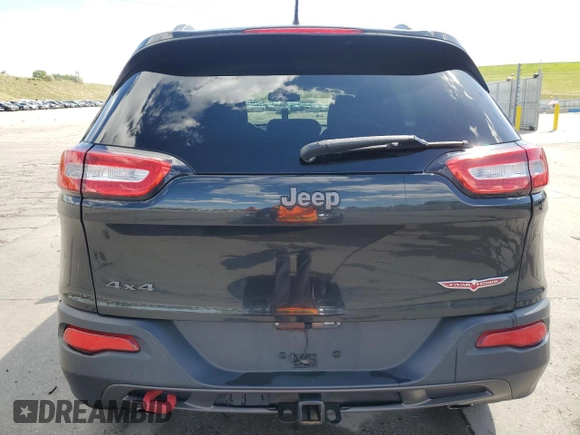 2014 Jeep Cherokee Trailhawk z VIN 1C4PJMBS1EW239692, wystawiony jako Copart lot #57153065 z przebiegiem 111 899 mil mil oraz Szkoda całkowita • Salvage title. Historia ofert i sprzedaży dostępna na DreamBid. Obrazek 6.