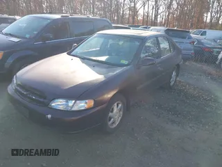 1999 Nissan Altima XE with VIN 1N4DL01D1XC193705, listed as a IAAI auction lot 40880059 with 183,605 mi miles. Bid and sale history available at carsss.com. Image 2.