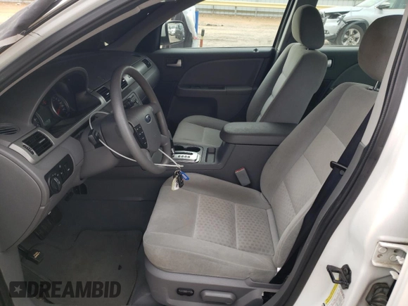 2005 Ford Five Hundred SE z VIN 1FAFP231X5G165841, wystawiony jako Copart lot #43117535 z przebiegiem 154 874 mil mil oraz Czysty tytuł • Clean title. Historia ofert i sprzedaży dostępna na DreamBid. Obrazek 7.