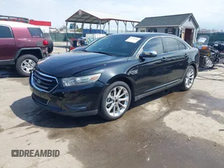 2014 Ford Taurus Limited with VIN 1FAHP2F80EG104984, listed as a IAAI auction lot 41910463 with 174,034 mi miles. Bid and sale history available at carsss.com. Image 2.