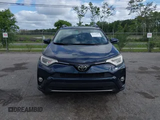 2018 Toyota RAV4 XLE with VIN JTMWFREV9JJ165655, listed as a IAAI auction lot 42138998 with 123,569 mi miles and . Bid and sale history available at carsss.com. Image 12.