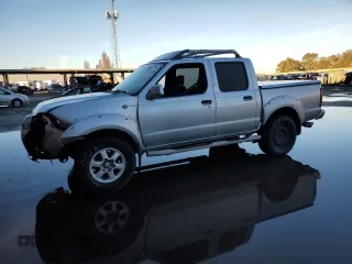 2001 Nissan Frontier SE z VIN 1N6ED27T61C347884, wystawiony jako Copart lot #86927184 z przebiegiem 115 910 mil mil oraz Szkoda całkowita • Salvage title. Historia ofert i sprzedaży dostępna na DreamBid. Obrazek 1.