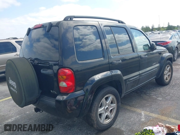 2003 Jeep Liberty Limited with VIN 1J4GK58K13W719457, listed as a IAAI auction lot 42088672 with 179,214 mi miles and . Bid and sale history available at carsss.com. Image 4.