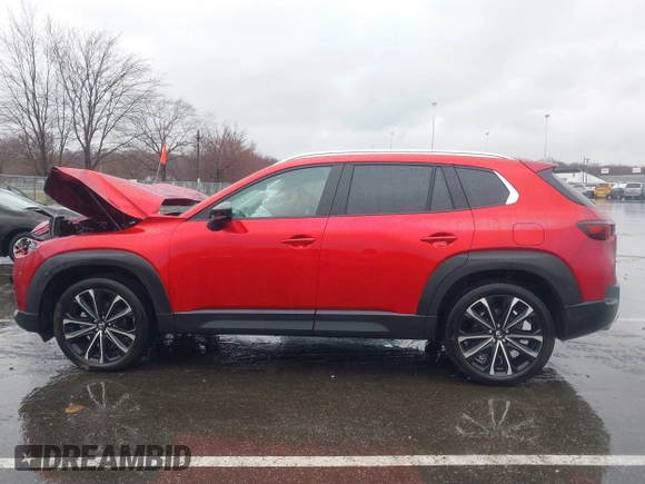 2025 Mazda CX-50 Premium z VIN 7MMVABDY3SN329439, wystawiony jako IAAI lot #41867334 z przebiegiem 3 508 mil mil oraz . Historia ofert i sprzedaży dostępna na DreamBid. Obrazek 14.