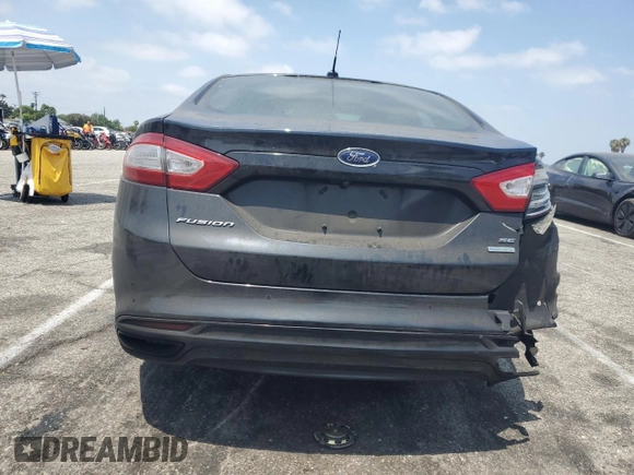 2013 Ford Fusion SE z VIN 3FA6P0H97DR215735, wystawiony jako Copart lot #62326335 z przebiegiem 100 312 mil mil oraz Szkoda całkowita • Salvage title. Historia ofert i sprzedaży dostępna na DreamBid. Obrazek 6.