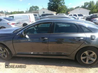 2021 Kia K5 LXS z VIN 5XXG14J25MG017125, wystawiony jako IAAI lot #42177700 z przebiegiem 55 855 mil mil oraz . Historia ofert i sprzedaży dostępna na DreamBid. Obrazek 14.