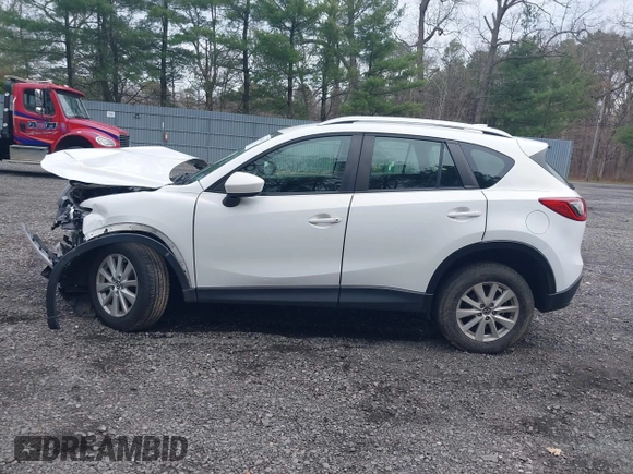 2014 Mazda CX-5 Sport with VIN JM3KE4BE3E0300849, listed as a IAAI auction lot 41942418 with 144,310 mi miles. Bid and sale history available at carsss.com. Image 14.