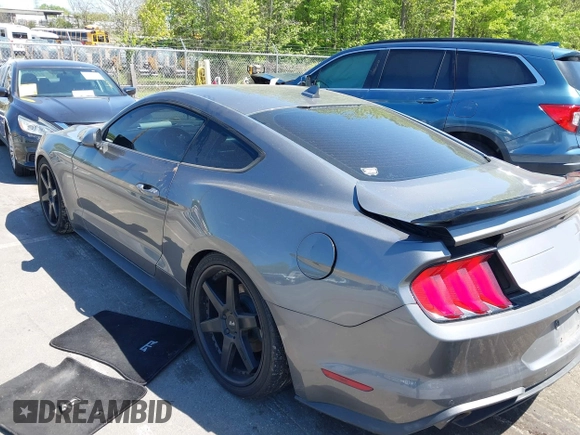 2021 Ford Mustang EcoBoost with VIN 1FA6P8TH3M5100601, listed as a IAAI auction lot 42060948 with 79,677 mi miles and . Bid and sale history available at DreamBid. Image 3.