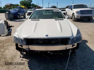 2009 Mercedes-Benz SL 550 with VIN WDBSK71F69F147589, listed as a Copart auction lot 65976995 with 77,387 mi miles and Salvage title. Bid and sale history available at DreamBid. Image 5.
