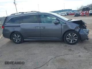 2016 Honda Odyssey Touring Elite z VIN 5FNRL5H99GB072860, wystawiony jako IAAI lot #42157603 z przebiegiem 221 449 mil mil oraz . Historia ofert i sprzedaży dostępna na DreamBid. Obrazek 13.