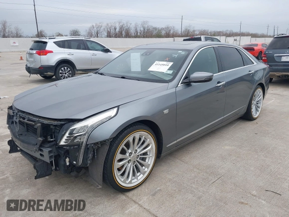 2018 Cadillac CT6 Luxury RWD z VIN 1G6KC5RX4JU159789, wystawiony jako IAAI lot #41145010 z przebiegiem 73 811 mil mil oraz . Historia ofert i sprzedaży dostępna na DreamBid. Obrazek 2.