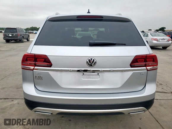 2018 Volkswagen Atlas SE с VIN 1V2CR2CAXJC563350, выставлен на аукционе Copart как лот 59360125 с пробегом 140 320 миль миль и Списание • Salvage title. История ставок и продаж доступна на DreamBid. Изображение 6.