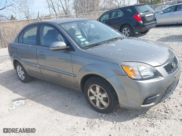 2011 Kia Rio LX with VIN KNADH4A39B6923388, listed as a IAAI auction lot 42060176 with 98,690 mi miles. Bid and sale history available at carsss.com. Image 1.