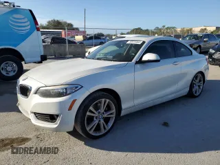 2015 BMW 2 Series 228i with VIN WBA1F5C59FV257321, listed as a Copart auction lot 80915464 with 113,776 mi miles and Salvage Title. Bid and sale history available at carsss.com. Image 1.
