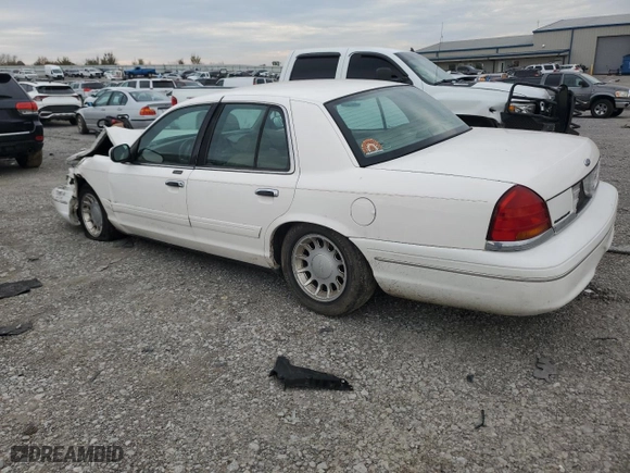 2000 Ford Crown Victoria LX with VIN 2FAFP74W4YX120352, listed as a Copart auction lot 79833264 with 0 mi miles and Salvage Title. Bid and sale history available at carsss.com. Image 2.
