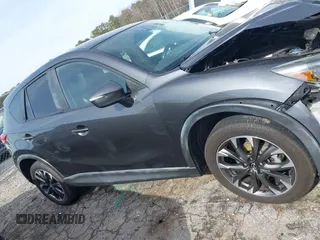 2016 Mazda CX-5 Grand Touring z VIN JM3KE4DY5G0836891, wystawiony jako IAAI lot #41441065 z przebiegiem 120 808 mil mil oraz . Historia ofert i sprzedaży dostępna na DreamBid. Obrazek 13.